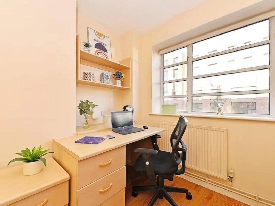 Desk laptop chair shelves plant window study area at St Andrews Gardens - Liverpool in Liverpool Student Accommodation