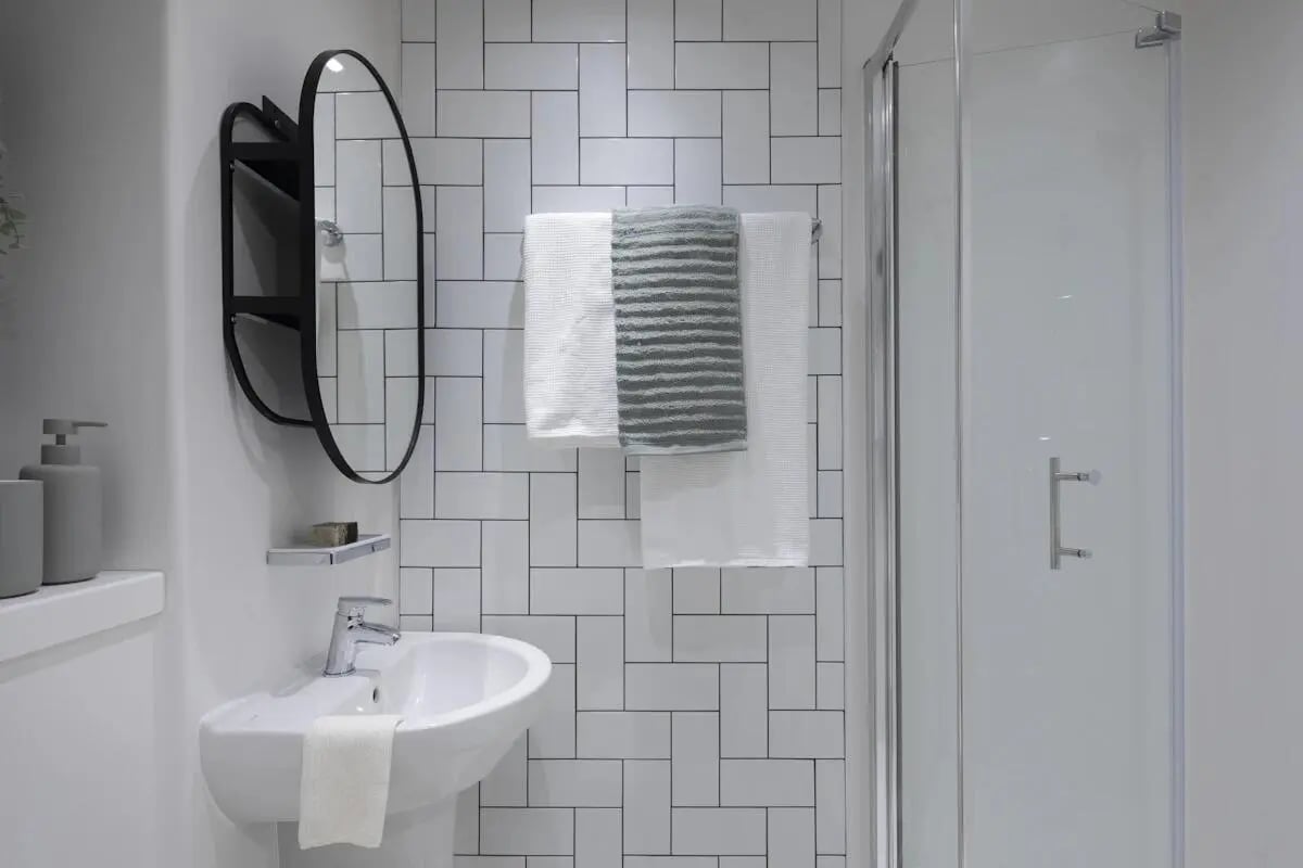 Sink mirror towels shower enclosure bathroom at The Keel Houses in Edinburgh Student Accommodation