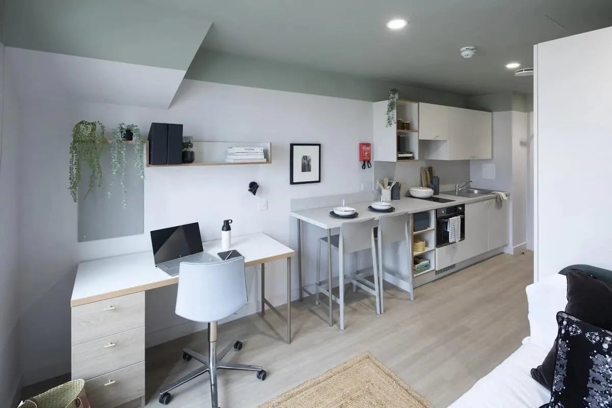 Desk chair laptop kitchen counters dining bar area studio at The Keel Houses in Edinburgh Student Accommodation