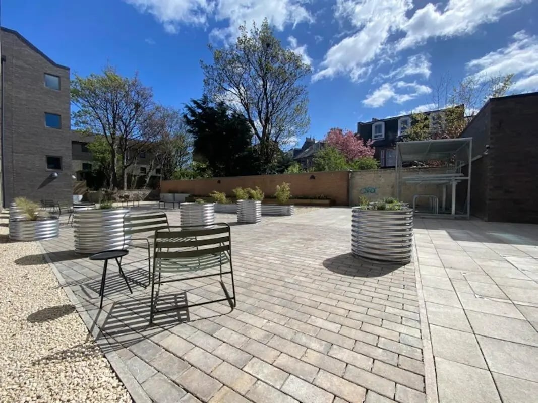 Metal planters and chairs outdoor courtyard exterior at The Keel Houses in Edinburgh Student Accommodation