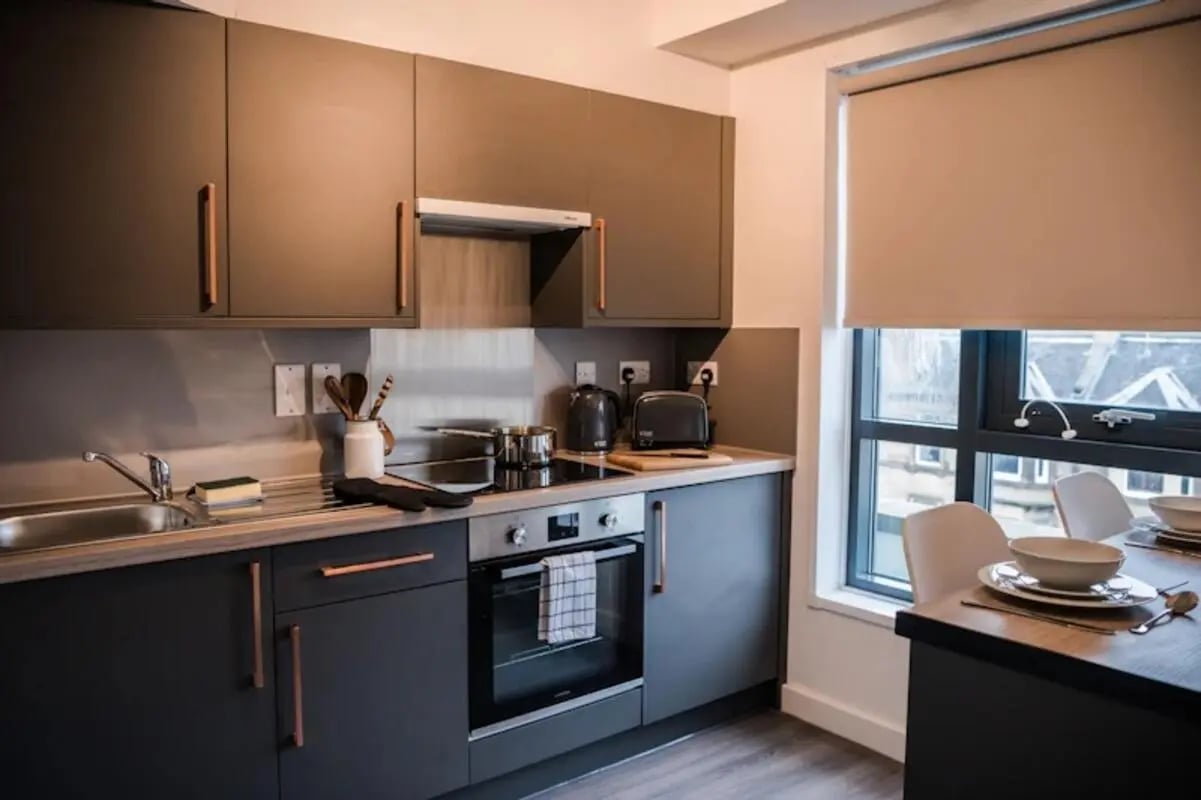 Modern kitchen with appliances and dining area kitchen at McDonald Road in Edinburgh Student Accommodation