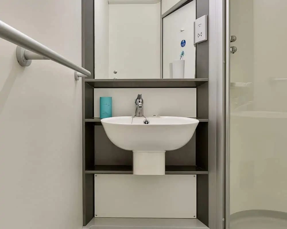 Sink with faucet and toiletries bathroom at Exeter Trust House in Exeter Student Accommodation