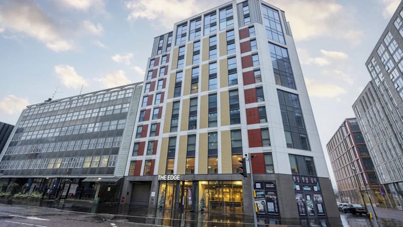 Modern student accommodation building with red yellow exterior exterior at The Edge in Belfast Student Accommodation