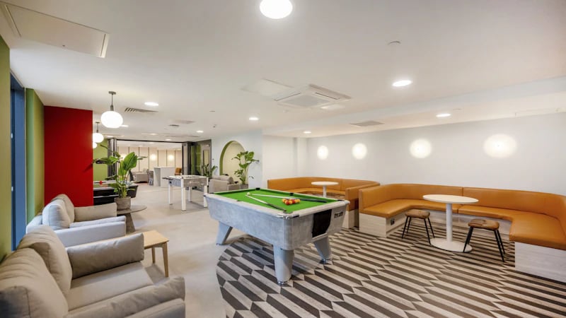 Pool table couches foosball table common area at The Edge in Belfast Student Accommodation