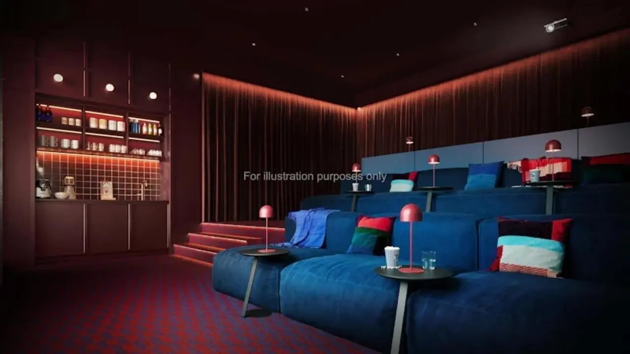 Blue tiered seating with pillows and lamps cinema at The Store House in Leeds Student Accommodation