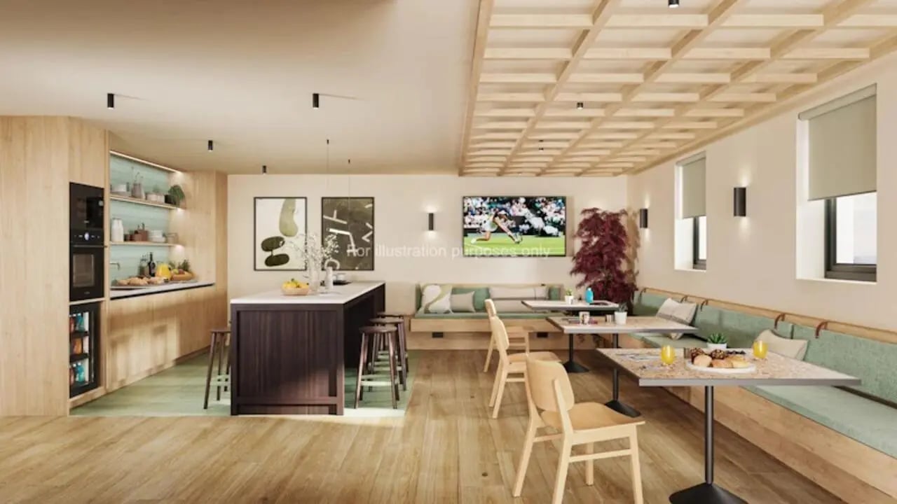 Modern kitchen dining area with seating lounge and TV communal area at The Store House in Leeds Student Accommodation