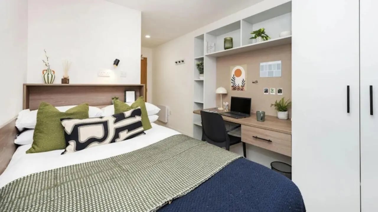 Bed desk and shelving unit bedroom at Raffles Hall in York Student Accommodation
