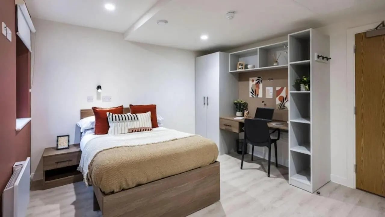 Bed desk and shelving student bedroom at Raffles Hall in York Student Accommodation
