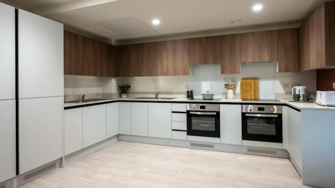Modern white and wood kitchen with appliances kitchen at Raffles Hall in York Student Accommodation