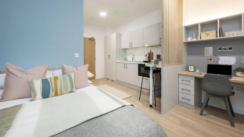 Bed kitchen and desk student studio bedroom at St Gabriels in Manchester Student Accommodation
