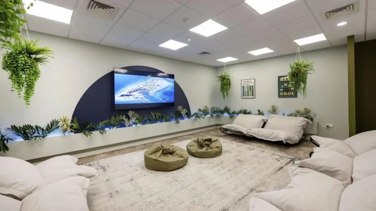 Modern lounge with TV beanbags and hanging plants lounge at The Glasshouse in Nottingham Student Accommodation