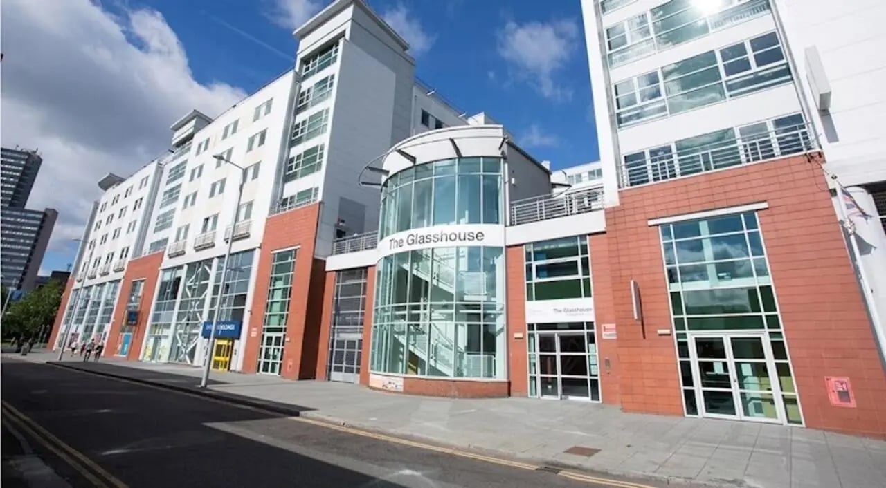 Modern student accommodation building with glass entrance exterior at The Glasshouse in Nottingham Student Accommodation