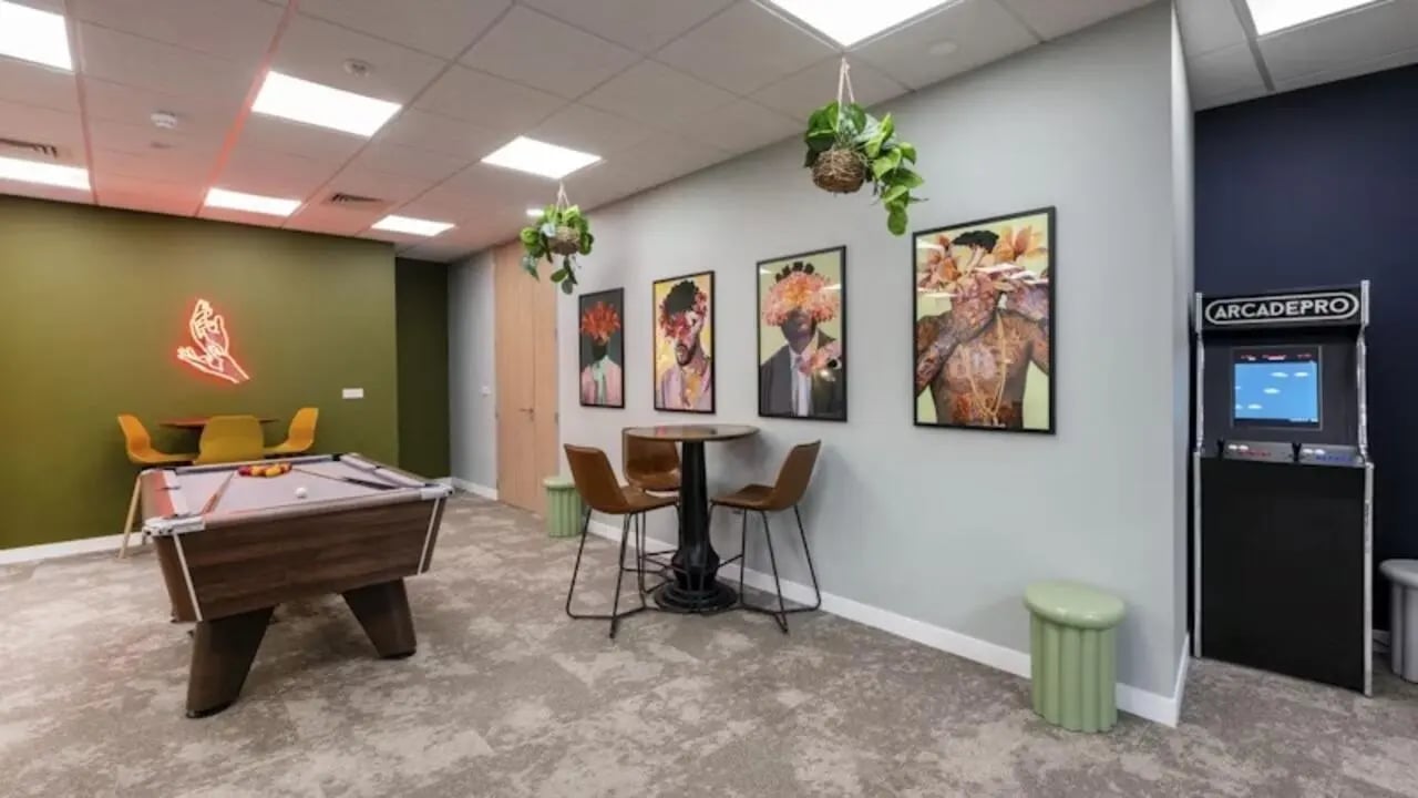 Pool table arcade game posters and plants playing area at The Glasshouse in Nottingham Student Accommodation