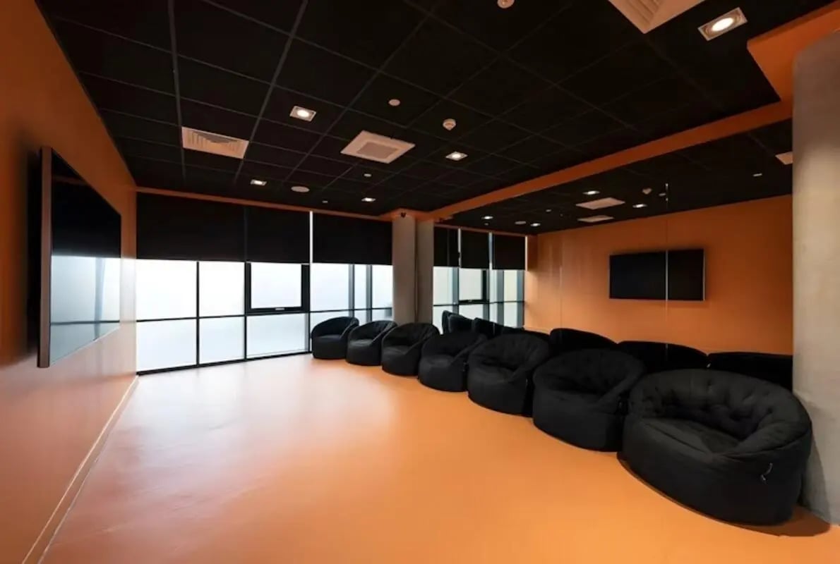 Beanbag chairs large windows and television lounge area at Luxurio in Loughborough Student Accommodation