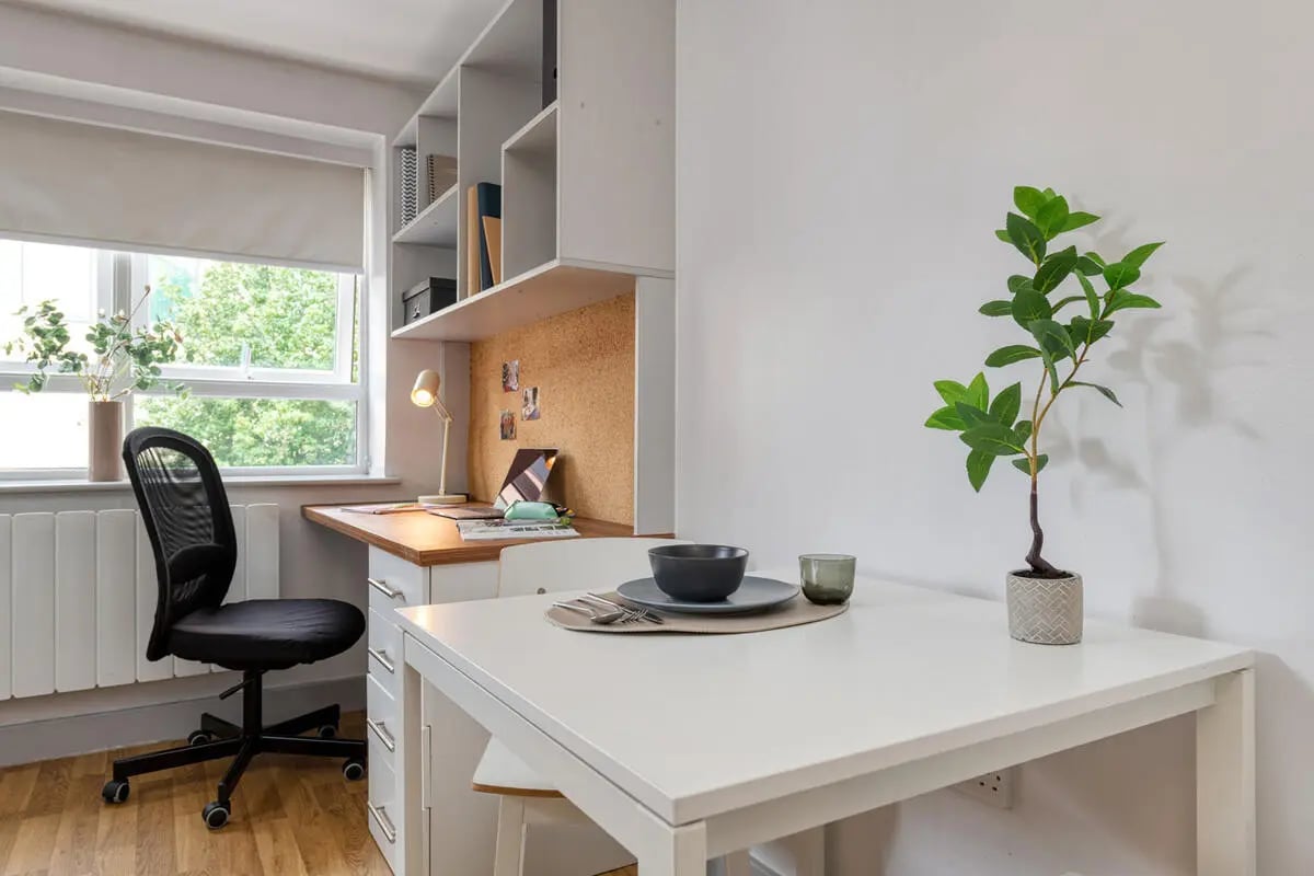 Desk with chair and dining table study area at Collegiate St James Street in Portsmouth Student Accommodation