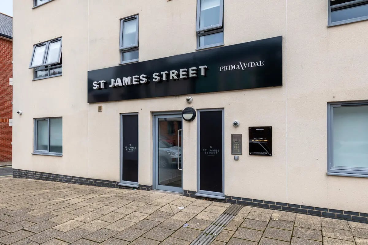 Building entrance with large sign and windows exterior at Collegiate St James Street in Portsmouth Student Accommodation