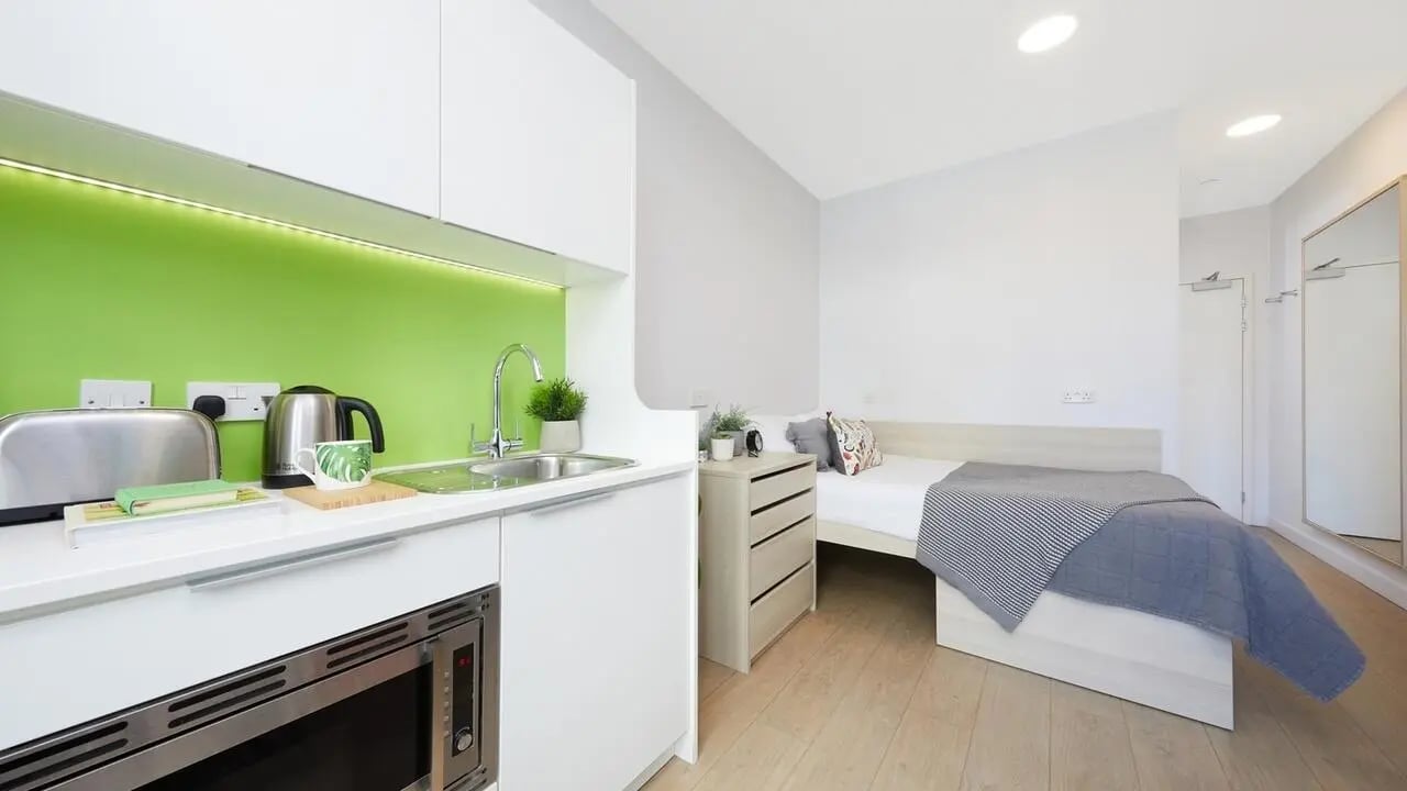Kitchenette and bed area with microwave studio apartment at Collegiate Middle Street in Portsmouth Student Accommodation