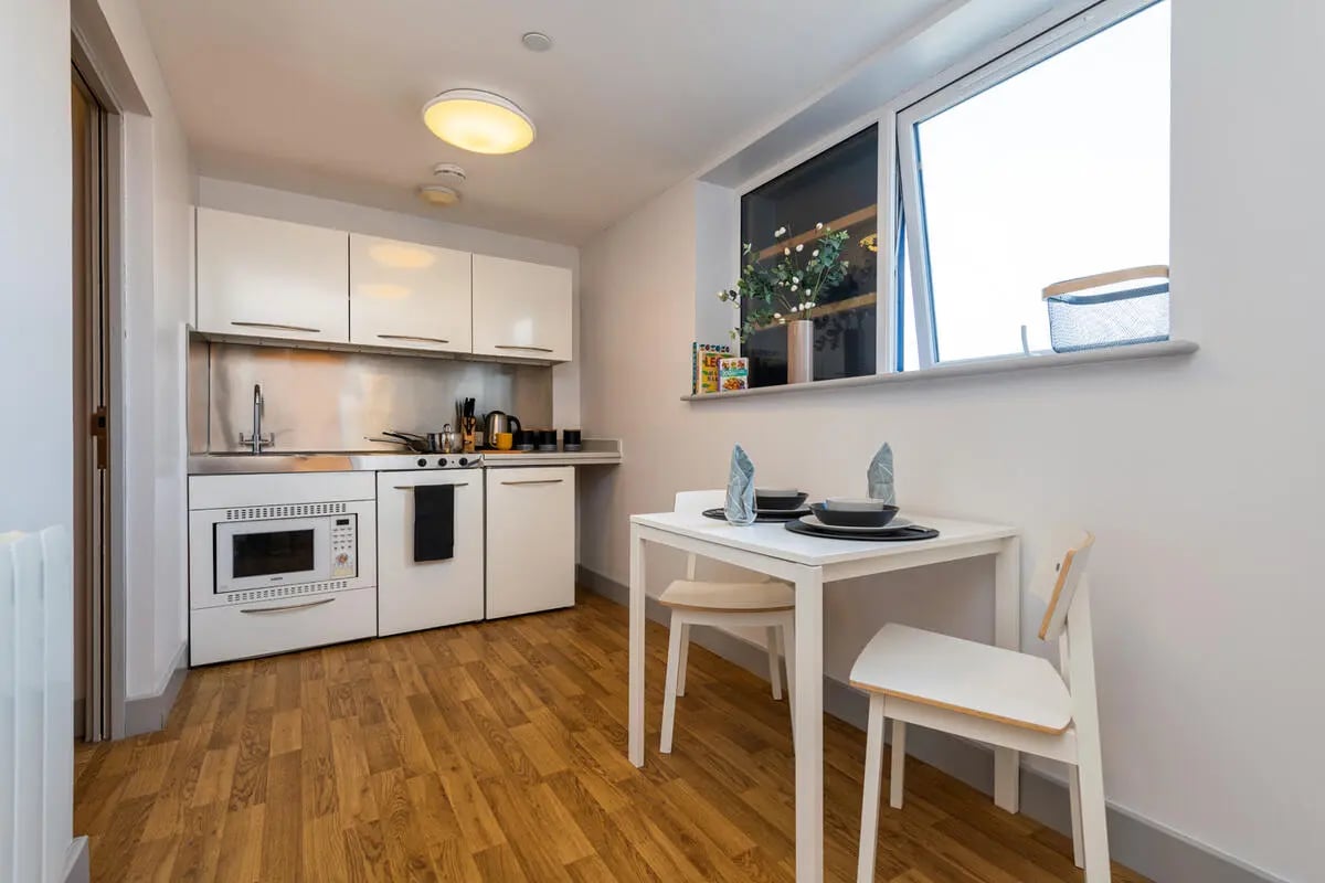 Compact kitchen with dining table kitchen area at Collegiate Earlsdon Street in Portsmouth Student Accommodation
