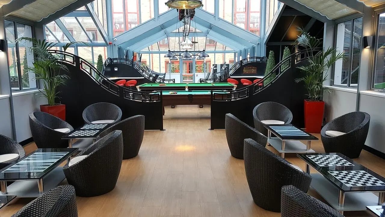 Pool table seating area with modern furniture lounge at Collegiate Castle Street in Cambridge Student Accommodation
