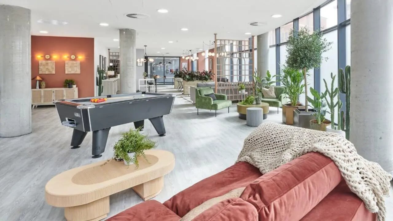 Pool table sofas plants modern lounge area at Gosford Gate in Coventry Student Accommodation