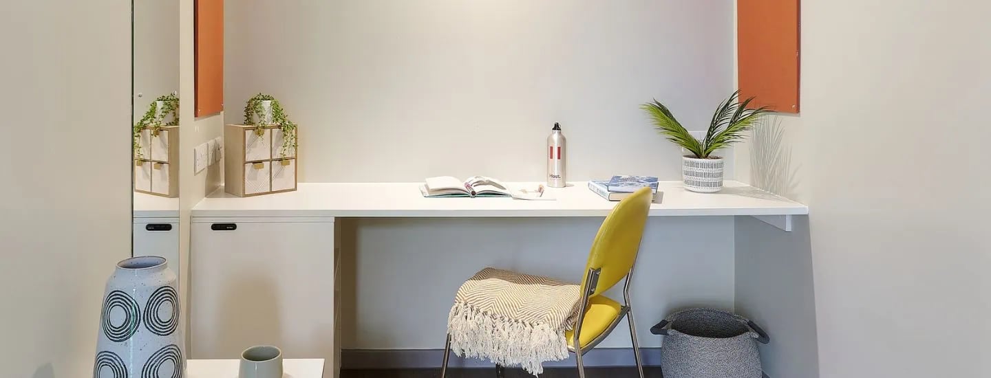 Desk with plants and books study area at Gosford Gate in Coventry Student Accommodation