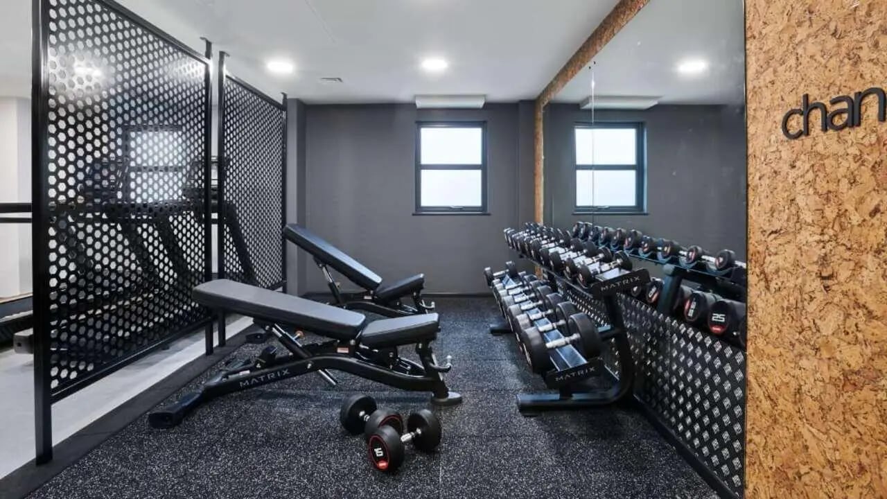 Weights benches and dumbbells fitness area at Sky Blue Point in Coventry Student Accommodation