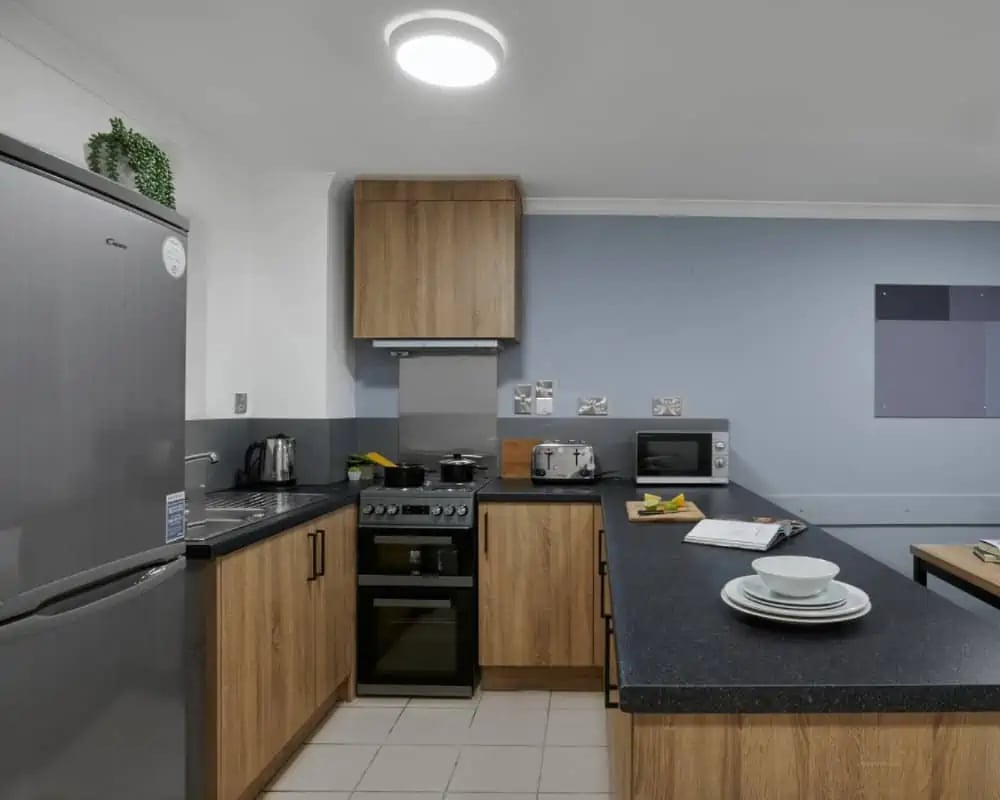 Modern student kitchen with appliances and cabinets kitchen at Sky Blue Point in Coventry Student Accommodation