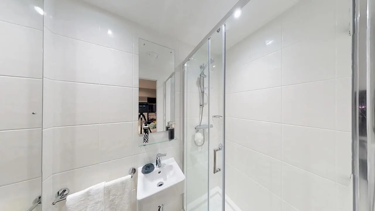 Shower sink mirror and towel rack bathroom at Collegiate Crown Place Cardiff in Cardiff Student Accommodation