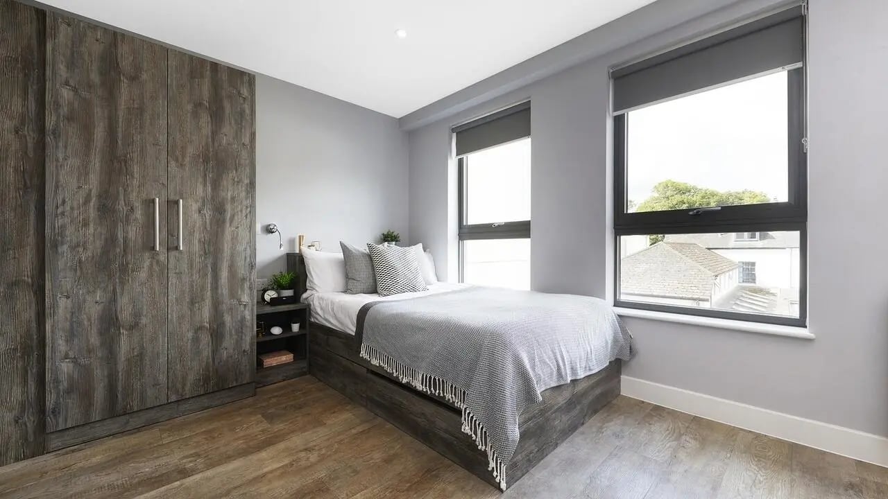 Wardrobe bed nightstand with decor bedroom at Collegiate Crown Place Cardiff in Cardiff Student Accommodation