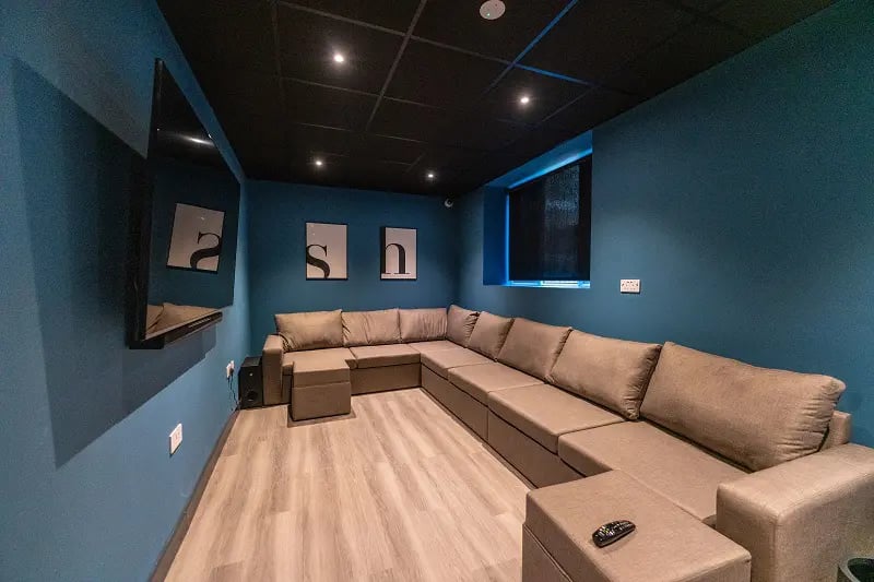 Large sectional sofa mounted TV modern living area at AXO Sherbourne Student Village in Coventry Student Accommodation