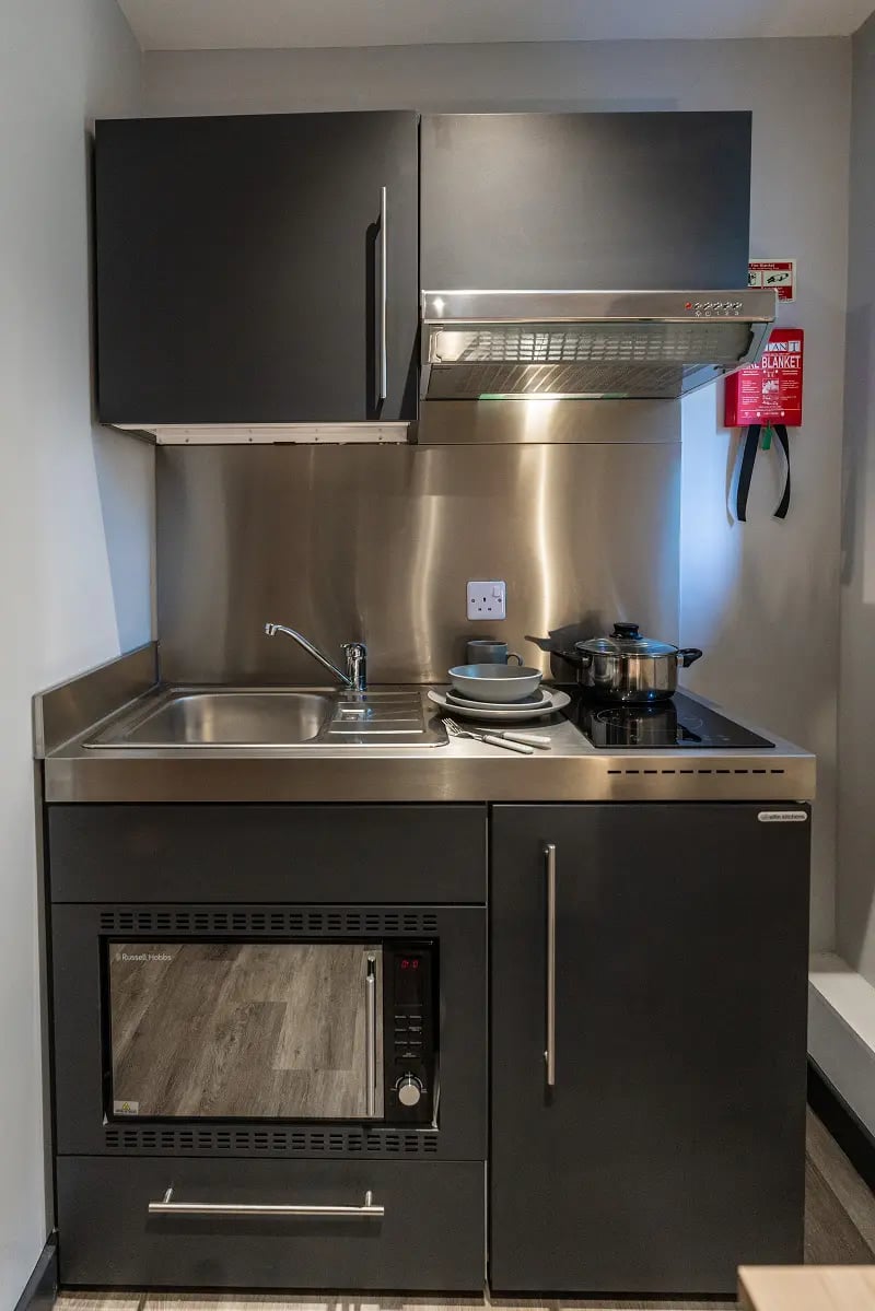 Compact kitchenette with microwave sink and hob kitchen at AXO Sherbourne Student Village in Coventry Student Accommodation