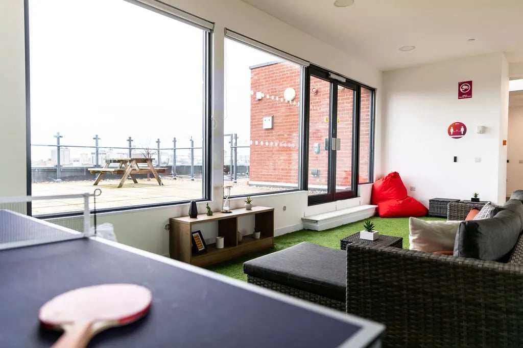 Ping pong table sofa red beanbag living room at City Heights - Cardiff in Cardiff Student Accommodation