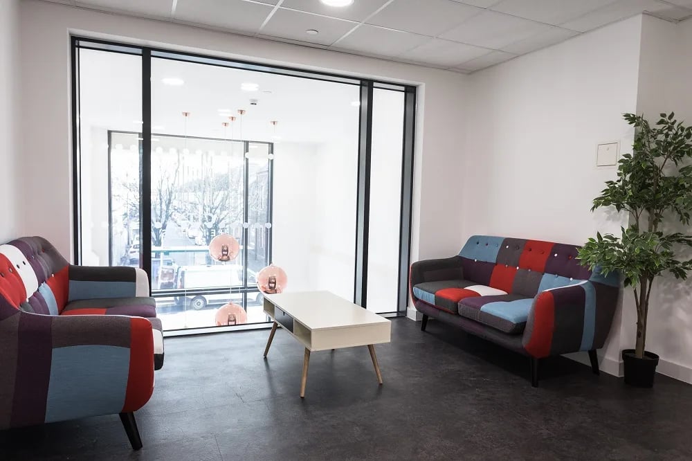 Patchwork sofas coffee table plant lounge living room at City Heights - Cardiff in Cardiff Student Accommodation