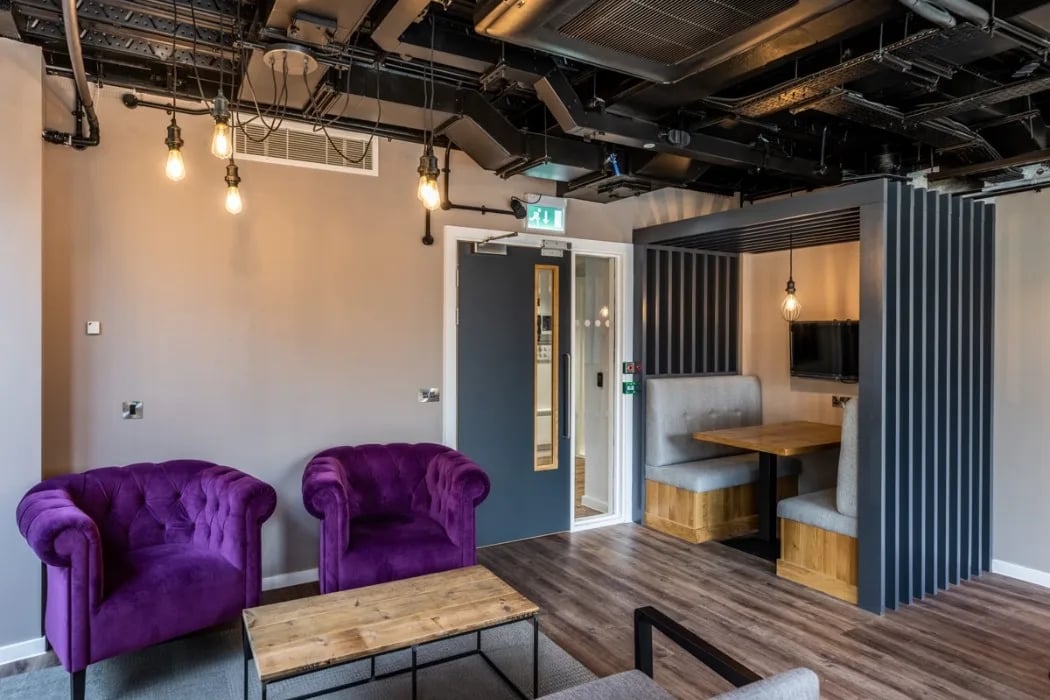 Purple armchairs coffee table booth seating study area at Murieston Crescent - Edinburgh in Edinburgh Student Accommodation