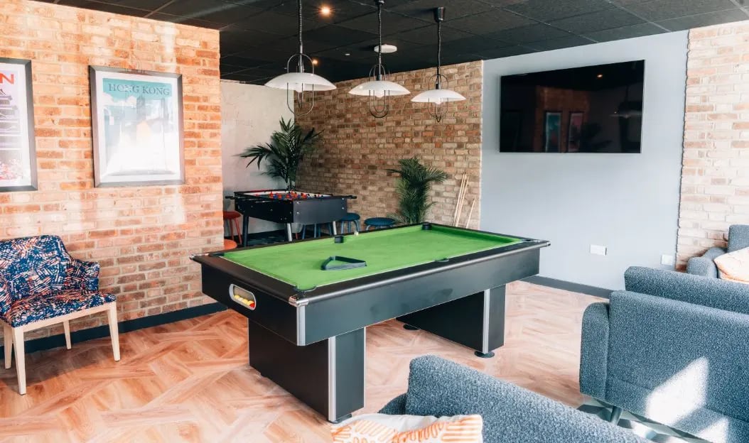 Pool table foosball table lounge area living room at Boutique Student Living - Exeter in Exeter Student Accommodation