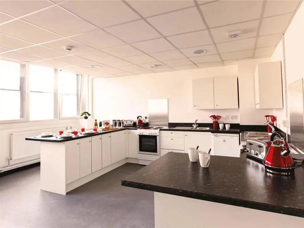 White cabinets stove and counter top kitchen at Glasgow West-End in Glasgow Student Accommodation
