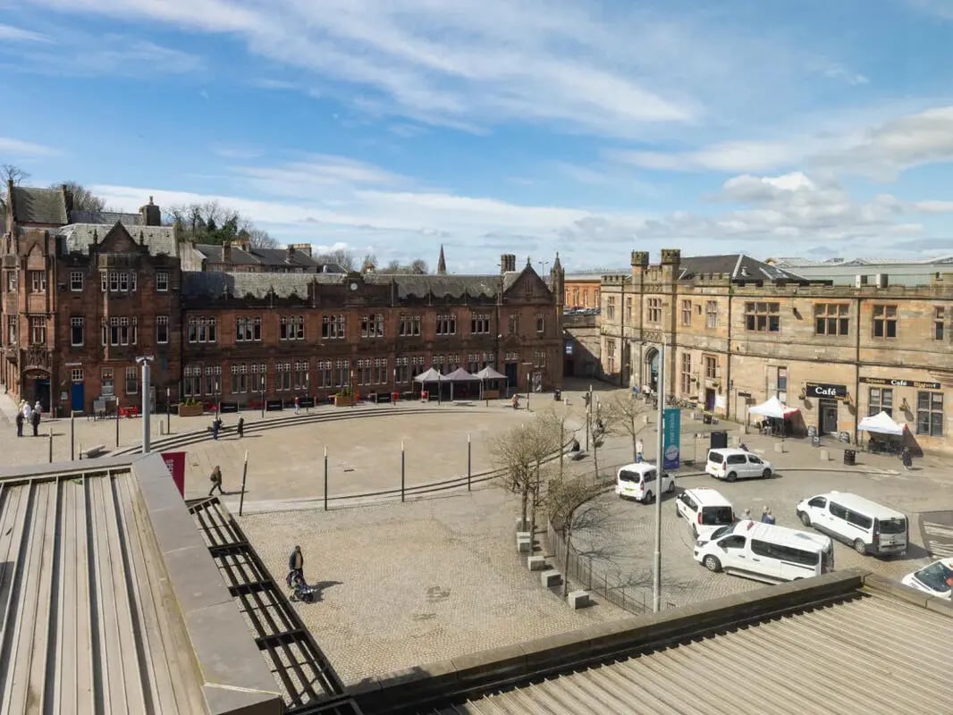 Historic buildings with vans in courtyard exterior at Glasgow West-End in Glasgow Student Accommodation