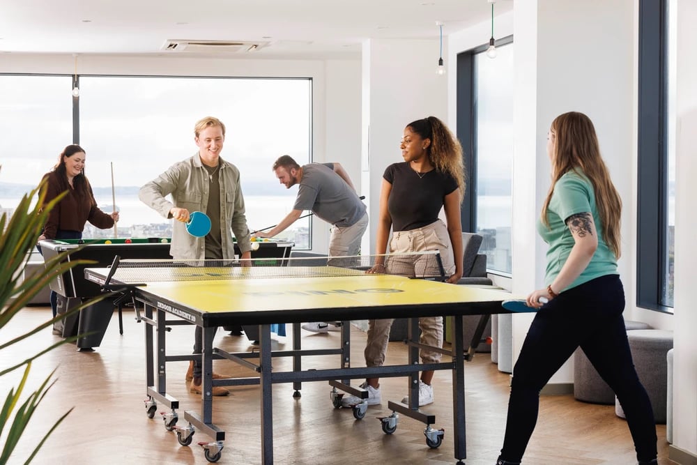 Ping pong table, pool table, people playing games common area at Greetham Street in Portsmouth Student Accommodation