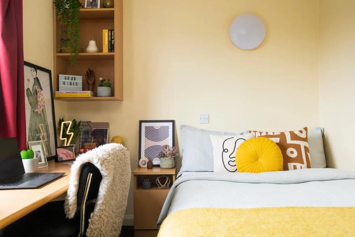 Bed desk and shelf student accommodation bedroom at Westhill Hall in Sheffield Student Accommodation