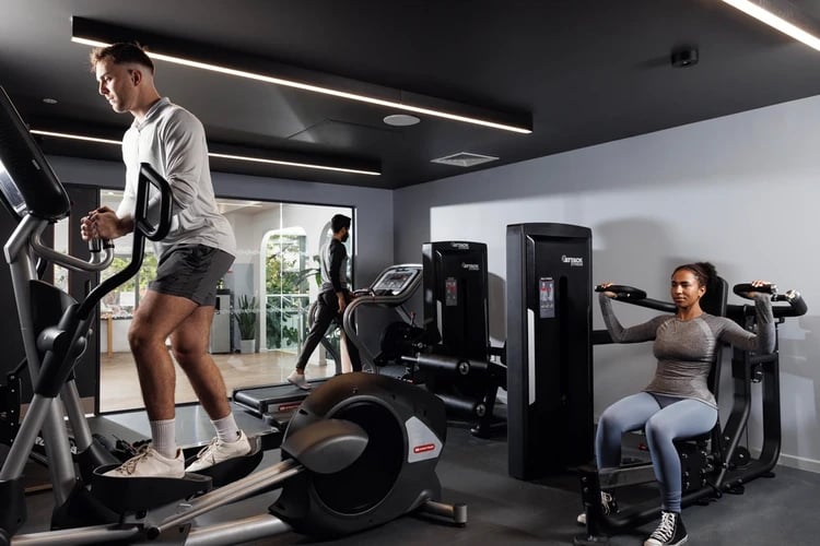 People using exercise machines gym at Stratford One in London Student Accommodation