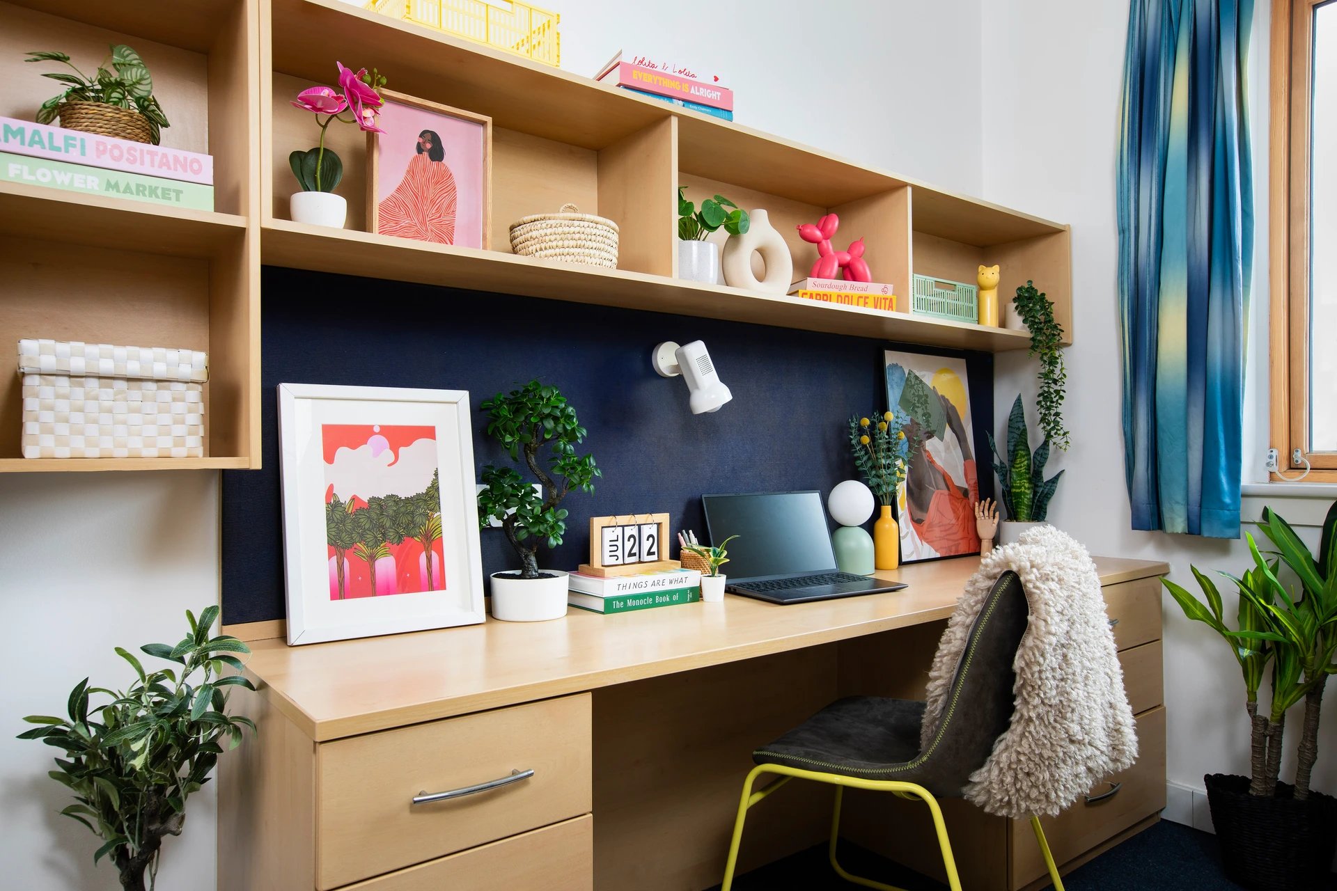 Desk with laptop plants and chair study area at Pier Quays in Medway Student Accommodation