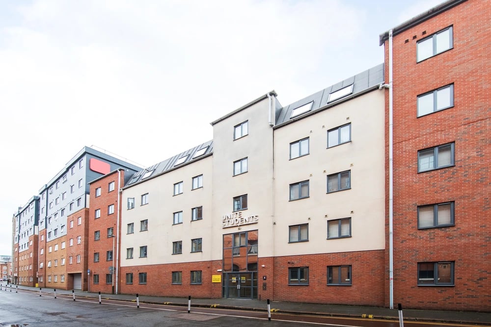Unite Students building exterior with brick and cream facade exterior at Grange Lane Apartments in Leicester Student Accommodation