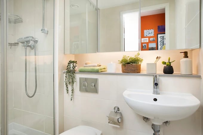 Shower sink and mirror with toiletries Bathroom at Adam Street Gardens in Cardiff Student Accommodation