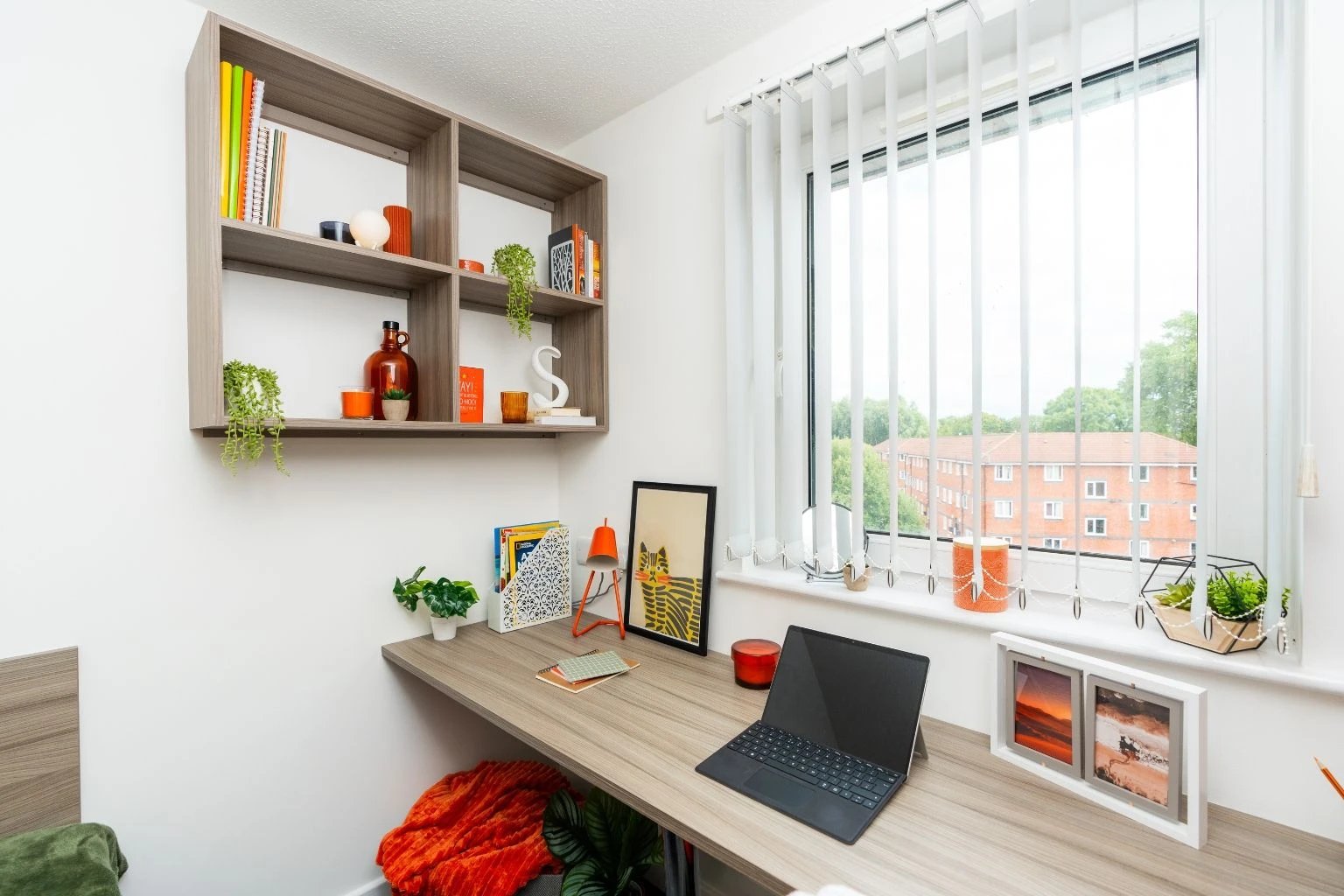 Desk with laptop and shelves Study area at Tramways - Salford in Salford Student Accommodation
