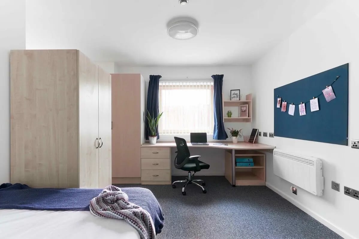 Bed desk chair closet window study area at Bernard Myers House in London Student Accommodation