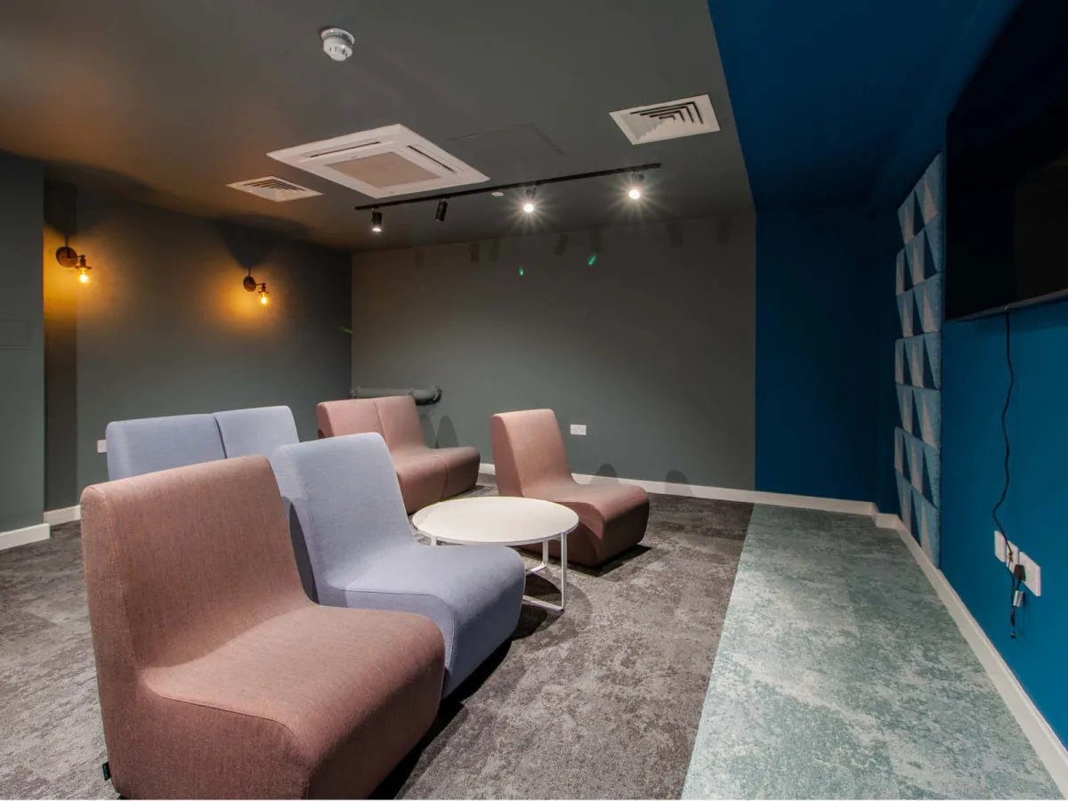 Modern sofas circular table communal lounge at The Refinery in Leeds Student Accommodation