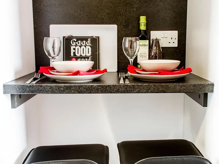 Tableware wine bottle and salt shaker kitchen area at Yugo Arran House in Edinburgh Student Accommodation