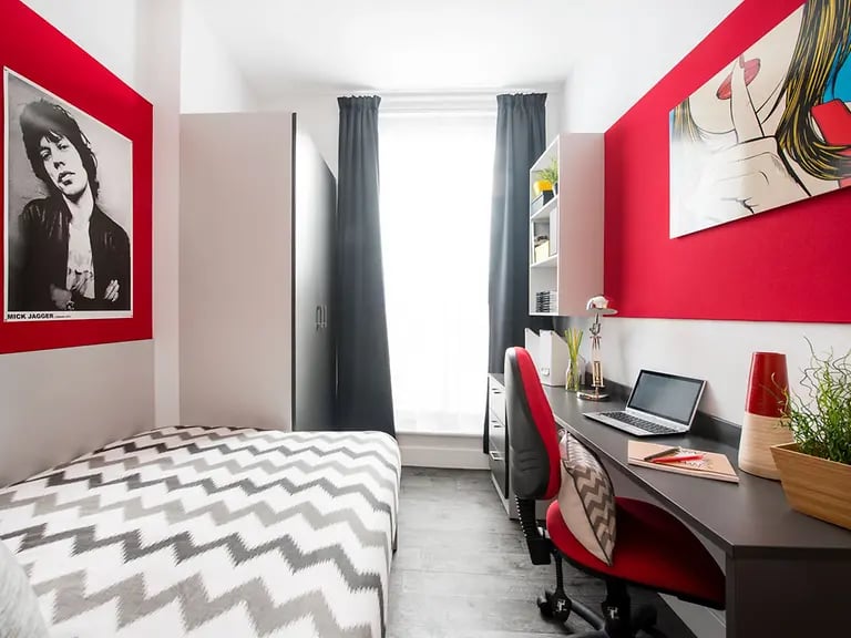Bed wardrobe desk with laptop artwork bedroom at Yugo Arran House in Edinburgh Student Accommodation