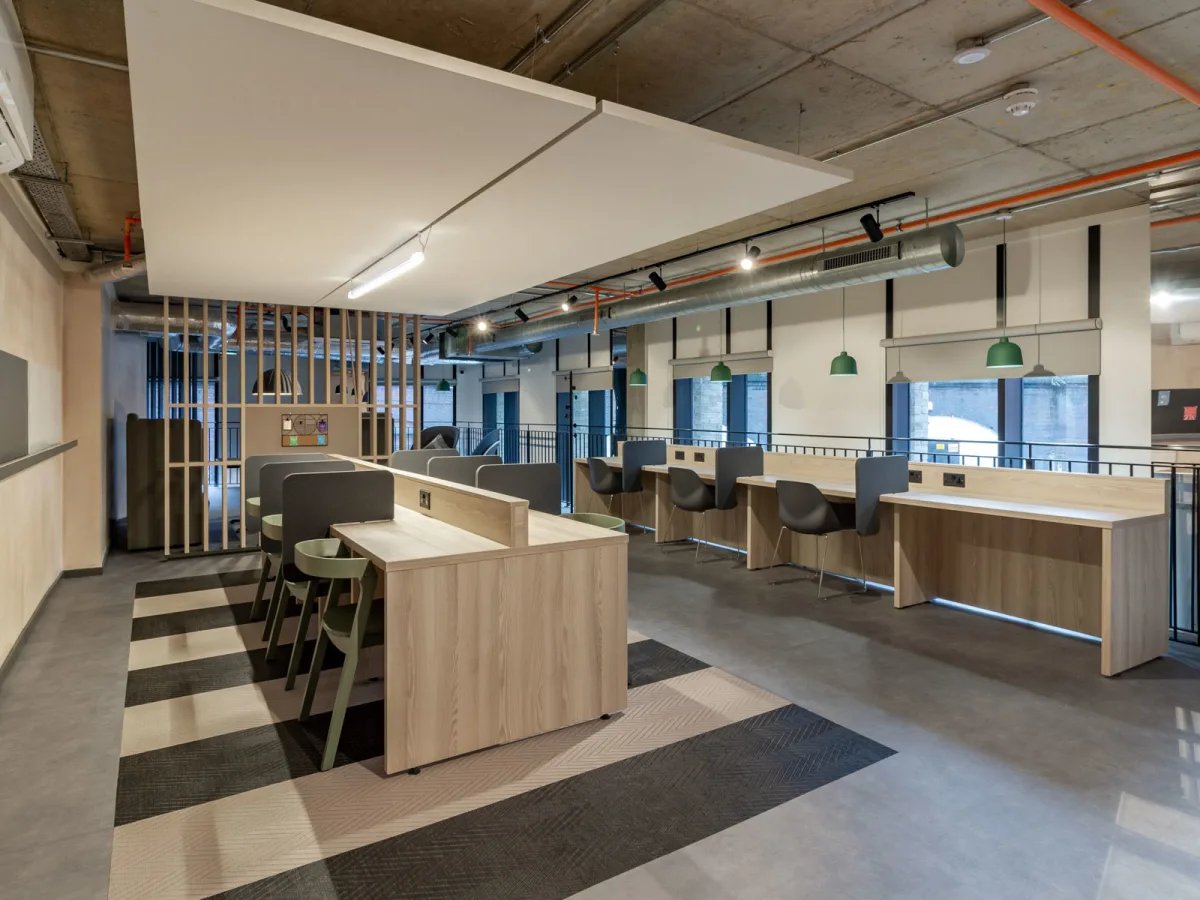 Desks partitions chairs and windows study area at The Tannery Leicester in Leicester Student Accommodation