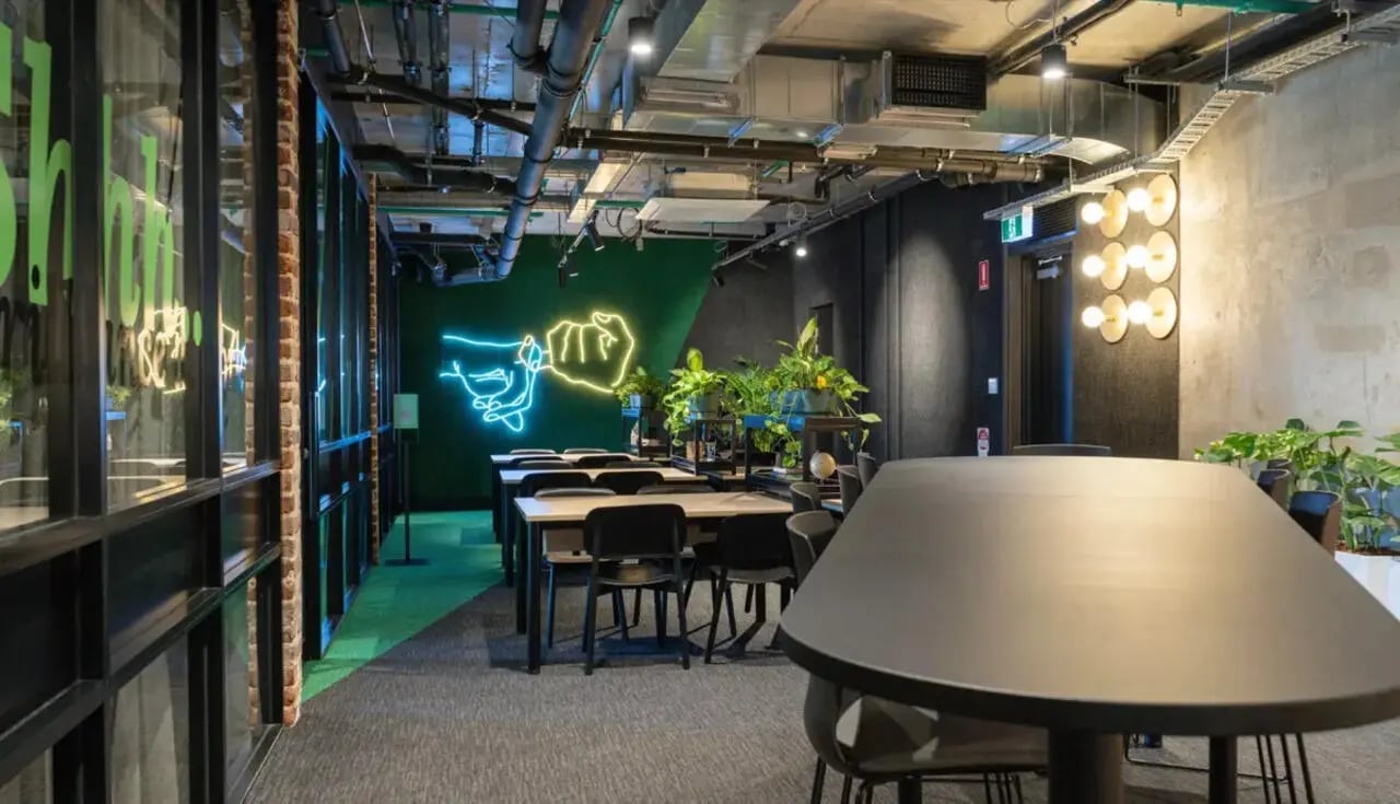 Desks chairs plants neon art study area at Perth Central in Perth Student Accommodation